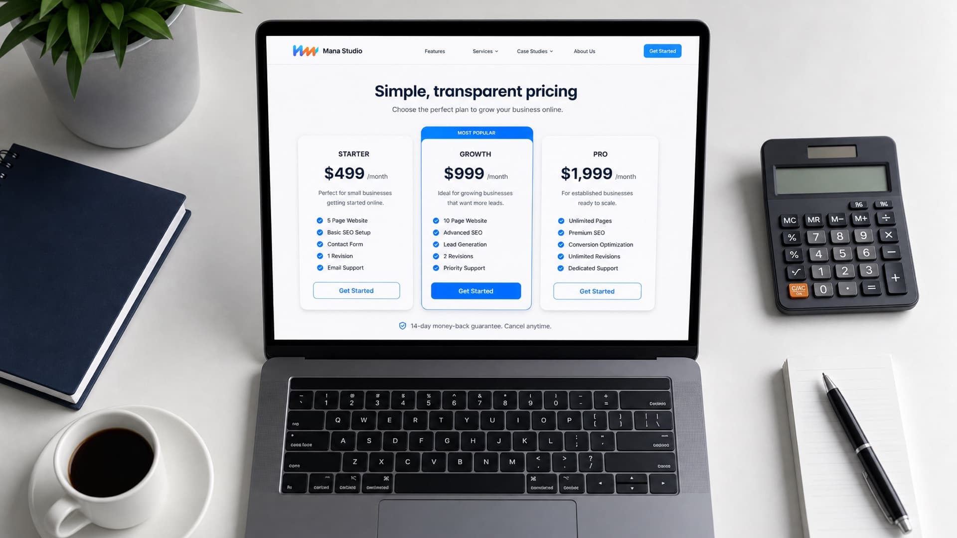 A laptop showing a website pricing page with three package tiers, beside a calculator and a notepad
