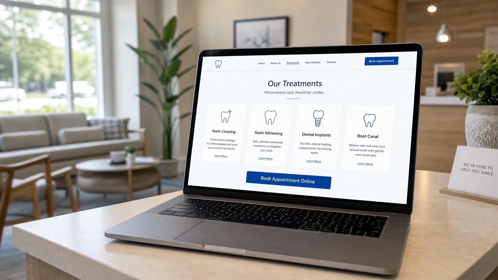 A laptop on a dental practice reception desk showing a treatments page with online booking buttons